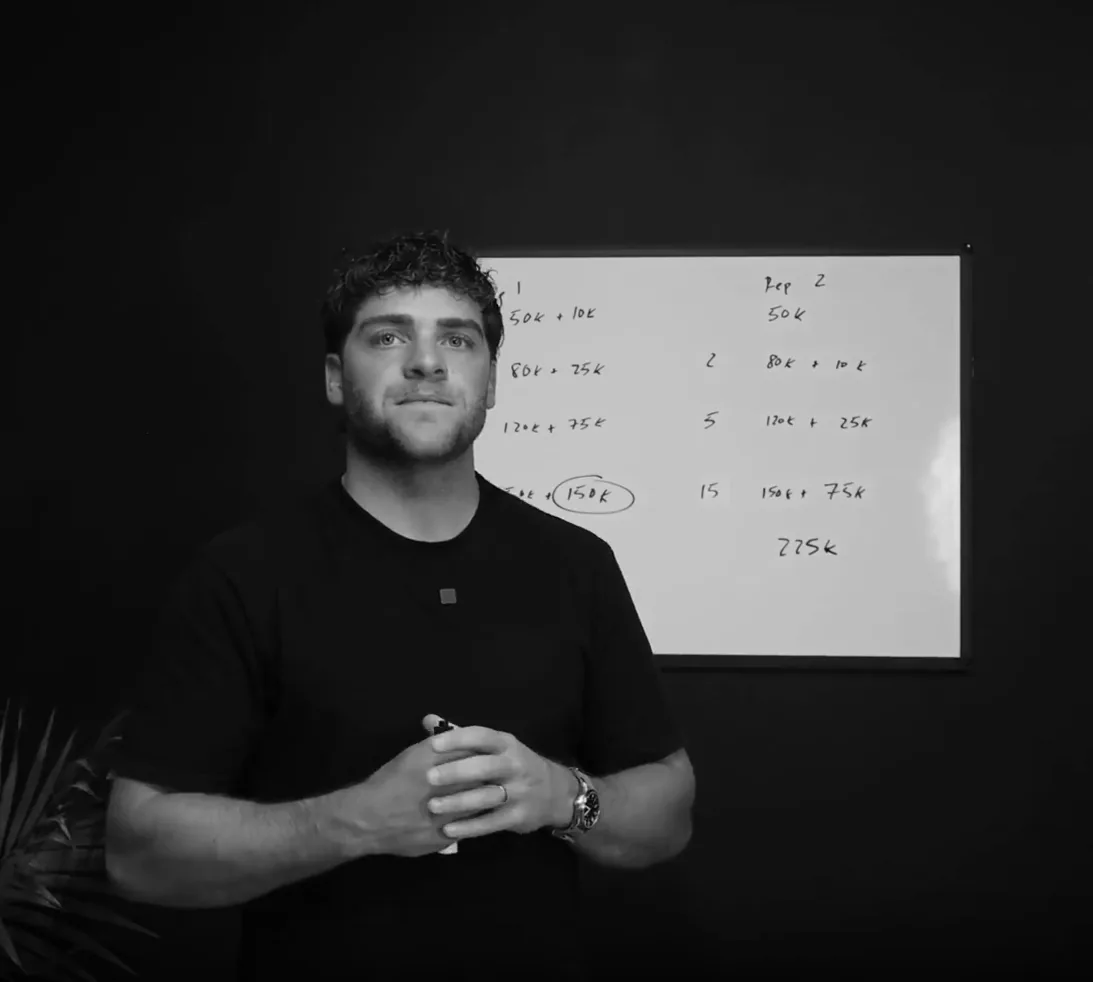 Jaxon presenting beside a whiteboard of rep compensation maths